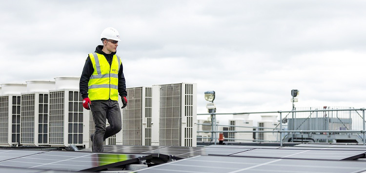 Lone worker on a roof. Equipped with security products such as personal safety alarm for Lone Workers by MiniFinder.