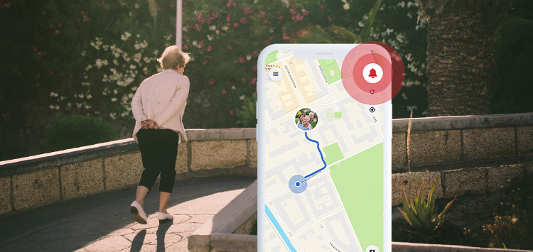 An elderly woman walking outdoors using a GPS safety alarm for added peace of mind