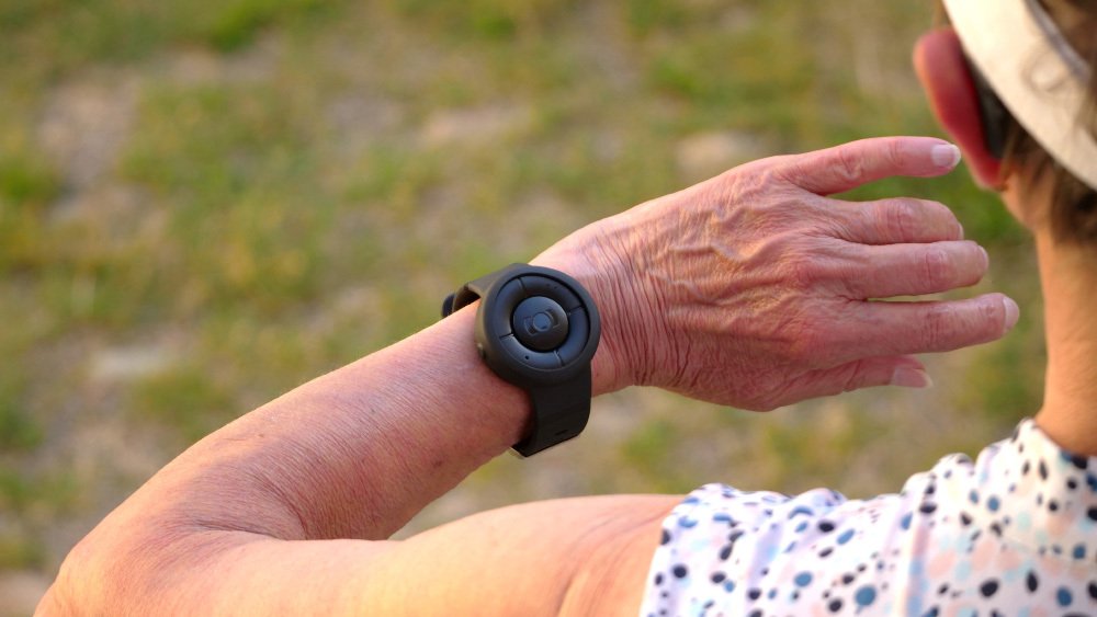 A person using a personal safety alarm while out for a walk