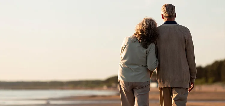 An elderly senior couple out for a walk using the MiniFinder Watch for health and safety